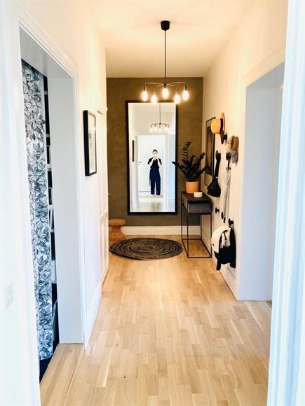 Entrance and hallway with two walk-in closets for storage.
