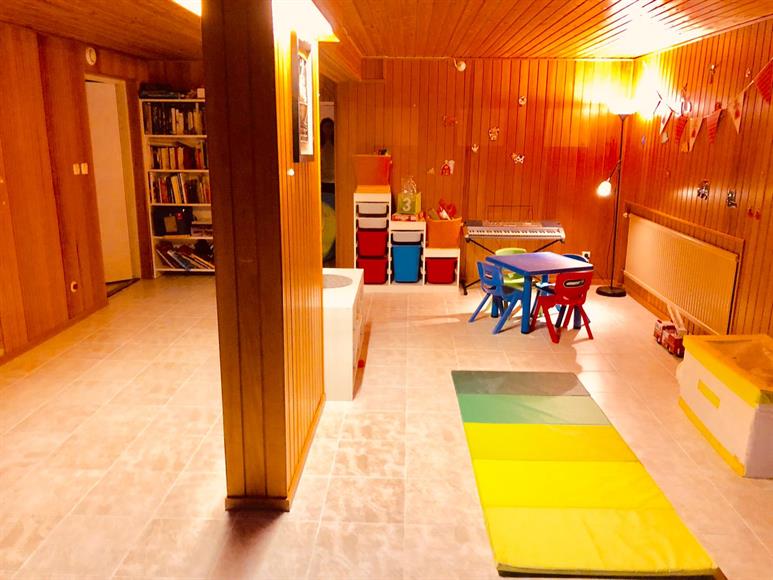 Large Living Room/PlayRoom/Game or TV Room - Lower Floor. Good for young kids for various activities . Solid flooring - Lower floor