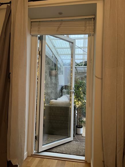 There is a door in the bedroom that leads out to the covered deck.