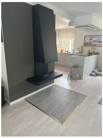 Eldstaden som knyter samman kök, matplats och vardagsrum.